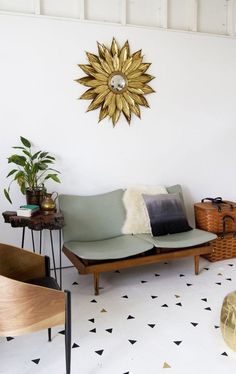 a living room filled with furniture and a clock on the wall