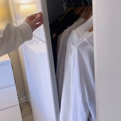 a person is trying to open a closet