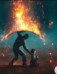 a man holding the back of a child as they both stand in front of fire