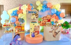 winnie the pooh birthday party with balloons and decorations