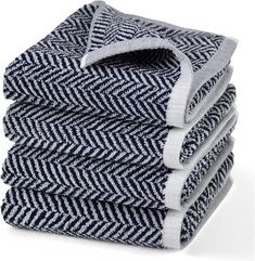 four folded towels stacked on top of each other in blue and white herringbones