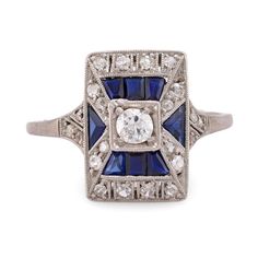 Center Stone: 1 Old European and 22 Single Cut Diamonds Total Diamond Weight: Approximately .30 Carats Color: I Clarity: SI Accent Stone: 8 Calibre Cut Blue Sapphires Weight: Approximately .40 Carats Metal: Platinum  Era: Art Deco Circa: 1930s Size: 5.25 and can be resized Gram weight: 2.3  This elegant Art Deco platinum ring from the 1930s features a beautiful arrangement of 1 old European cut diamond and 22 single cut diamonds, with a combined weight of approximately 0.30 carats, graded I color and SI clarity. The ring is further accented by 8 vivid calibre cut blue sapphires, totaling approximately 0.40 carats, creating a striking contrast and a unique geometric design. Weighing 2.3 grams, this ring perfectly captures the refined style and sophistication of the Art Deco era, making it a Art Deco Sapphire Ring, Platinum Diamond Engagement Rings, Platinum Diamond Rings, Gold Cocktail Ring, Modern Art Deco, Estilo Art Deco, Elegant Art, Band Jewelry, Wedding Rings Vintage