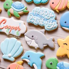 decorated cookies are arranged on a table for a birthday party or baby's first birthday