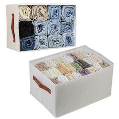 an open storage box filled with folded towels and cloths on top of each other