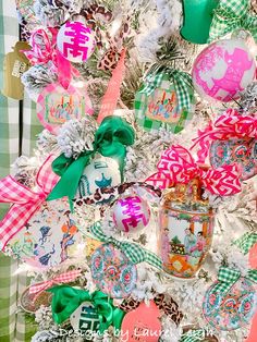 a christmas tree decorated with ornaments and bows