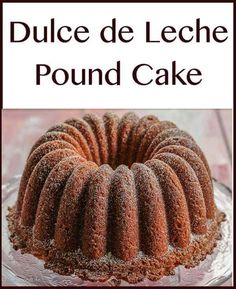 a bundt cake with powdered sugar on top and the words, dulce de leche pound cake above it