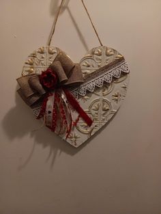 a heart shaped decoration hanging on a wall