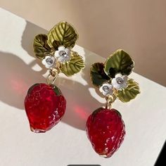 Brand New In Original Packaging Beautiful Pair Of Crystal Drop Earrings Featuring Red Strawberries With A Green Leaf And Small White Flowers With Rhinestone Accents For Pierced Ears. Made Of Zinc Alloy And Stainless Steel, Enameled. Perfect Summer Weather Festive Fun Earrings For Women Or Girls, Cute, Delicate, Feminine Design. Only This One Pair Available! Shipping Promptly From A Clean Healthy Vapor Smoke And Pet Free Home. Food Earrings, Small White Flowers, Red Strawberry, Romantic Valentine, Leaf Flowers, Crystal Drop Earrings, Red Crystals, Girls Jewelry, Fun Earrings