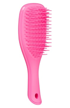 What it is: A detangling hairbrush in a travel size designed specifically for use in the shower, featuring a handle and no-slip design. What it does: This brush detangles without pulling, tugging or snagging hair. Its teeth glide effortlessly through all types of wet hair, making for an easy and painless experience. Plastic Made in the UK Mini Tangle Teezer, Mini Hairbrush, Girly Christmas Gifts, Makeup Bag Essentials, Hair Brushes, Pink Girly Things, Cute Preppy Outfits