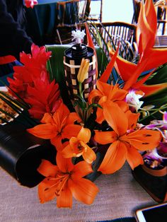 an arrangement of flowers on a table at a party