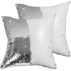 two silver sequin pillows sitting next to each other