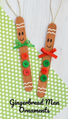 two gingerbread man ornaments made out of popsicle sticks