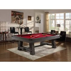 a pool table in the middle of a living room