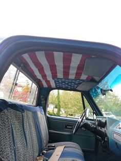 the interior of a car with an american flag on it