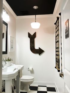 a bathroom with black and white checkered flooring