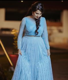 A woman in an Engagement  Lehenga dress Engagement Lehengas, Blouse Desine, Chudi Designs, Wendy's Lookbook, Lehenga Designs Simple, Lehnga Dress