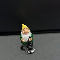 a gnome figurine sitting on top of a table