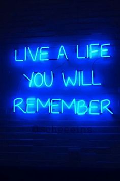 a neon sign that says, live a life you will be remembers on the wall