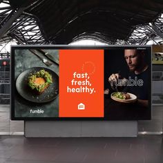 an advertisement for a fast, fresh, healthy restaurant on the side of a train station