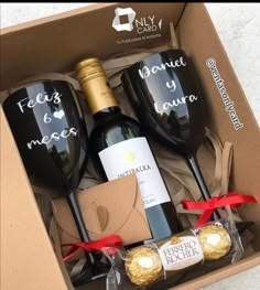 three wine glasses and two chocolates in a box