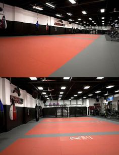 the inside of a gym with red and black mats