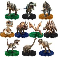 an assortment of dinosaur figurines sitting on top of each other in front of a white background