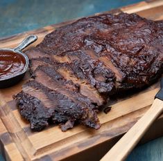 barbecue ribs with bbq sauce on a cutting board