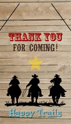 a wooden sign that says thank you for coming happy trails with two cowboys on horseback