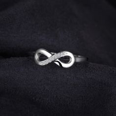 Count your blessings and give thanks to your most cherished friend with this sterling silver ring. A simulated diamond-accented open heart and infinity symbol perfectly capture your hope for an eternal bond. From Sentimental Expressions; Jewelry with a Message. Show your infinity love with this jewelry set. Metals Type: SILVERGender: WomenMain Stone: ZirconFine or Fashion: FineSetting Type: Prong SettingShape\pattern: GEOMETRICMetals Type: 100% Real 925 Sterling Silver Ring Size Adjuster, Silver Infinity Ring, Instagram Cool, Sterling Silver Promise Rings, Infinity Ring, Valentines Jewelry, Finger Ring, 925 Jewelry, 925 Silver Rings