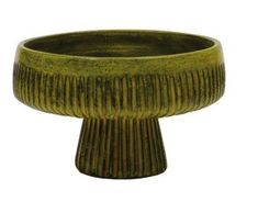 a green ceramic bowl sitting on top of a table