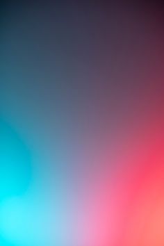 an abstract blurry background with red and blue colors