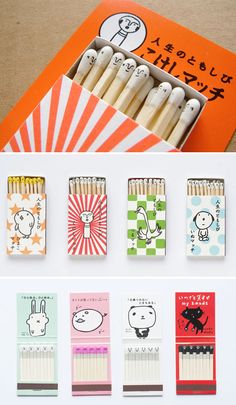 an assortment of matches in a box with japanese writing on them and pictures of animals