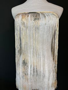 The high quality  fringe adds the perfect accent to clothing such as flapper dresses, Indian shawls, belly dance hip scarves other costumes, curtains, lampshades and home decor items. 19" / 47cm width This beautiful fringe has been specially made by FAN design for couture collections. Beautiful Cream Fringe with a gorgeous print. Create unusual pieces with this amazing fringe.  Price per metre / 39". Fringe Couture, Glamorous Floor-length Dress With Beaded Fringe, Floor-length Fringe Evening Dress, Luxury Floor-length Dress With Rhinestone Fringe, Elegant Floor-length Evening Dress With Rhinestone Fringe, Hip Scarves, Collection Couture, Long Fringes, Fringe Dress