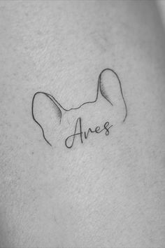 minimal dog ear silhouette tattoo Animal Name Tattoos, Dog Ear Tattoo With Name, Tattoos In Honor Of Dogs, Dog Honor Tattoo, Tattoo To Honor Dog, Personalized Dog Tattoo, Frenchie Memorial Tattoo, Dog Tattoo With Name, Dogs Name Tattoo