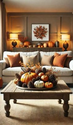 a living room filled with furniture and lots of pumpkins on top of a coffee table