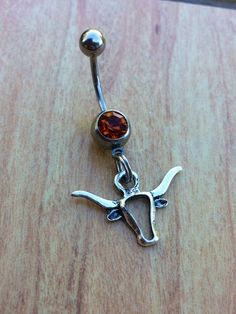 I'm loving this Texas Longhorn belly ring! Western Fashion Jewelry, Cute Belly Rings, Belly Button Piercing Jewelry, Belly Piercing Jewelry, Cowgirl Accessories, Bota Country, Country Jewelry, Tattoos Geometric, Belly Button Jewelry