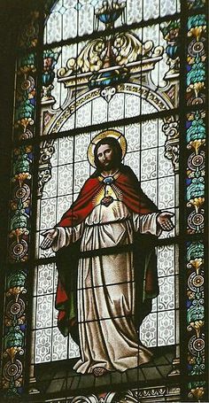 a stained glass window with the image of jesus