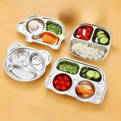 four different containers with food in them on a table