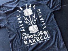 Sometimes the barbell gets heavy, those deadlifts feel miserable, your body hurts. You know what feels heavier than any barbell thrown in the way of your success? Failure. Failure is far heavier than any barbell. Available sizesSmall, Medium, Large, XL, 2XL, 3XLLightweight and soft, the shirt feels like one you've had your whole life. 4.2 oz. 50% Polyester, 25% Cotton, 25% Rayon. Gym Tshirt Design, Crossfit Tshirts, Crossfit Shirts, Hustle Motivation, Weightlifting Shirts, T-shirt Design Illustration, Crossfit Clothes, Gym Design, Mens Workout Clothes