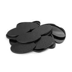 several black discs are stacked on top of each other in the shape of a flower