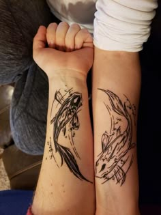 two people with matching tattoos on their arms