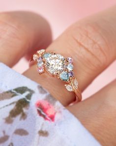 a close up of a person's hand with a ring on top of it