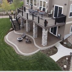 an aerial view of a house with patio and stairs