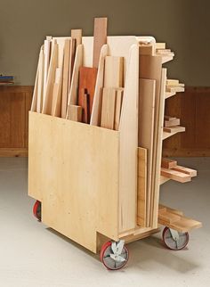 a wooden cart filled with lots of different types of wood