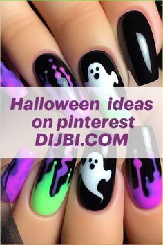 halloween nail art with black, green and purple designs