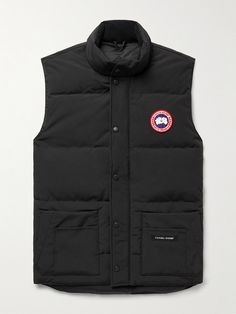 Canada Goose updates its popular 'Freestyle' gilet with a slimmer cut in this 'Crew' version. Designed for lightweight warmth, it's made from durable, water and wind-resistant Arctic Tech and quilted to keep the insulating down fill evenly distributed around your core. The stand collar is lined in soft microfibre for comfort, while six front pockets and two inside provide plenty of storage. Canada Goose Vest, Sleeveless Coat, Outdoor Jacket, Body Warmer, Short Suit, Casual Blazer, Loungewear Shorts, Warm Coat, Mr Porter