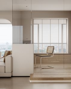 an office with a couch, chair and desk in front of a window that has blinds on it