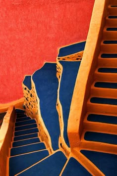 the stairs are painted red, blue and yellow