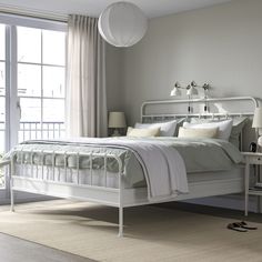 STJÄRNÖ bed frame, white/Lyngör white, King. STJÄRNÖ is a classic bed frame with decorative details that add a twist to the steel design – and LYNGÖR mattress base gives extra height and helps your mattress keep its shape for longer. Top frame/ Bottom headboard rail/ Headboard leg/ Footboard/ Bottom footboard rail/ Bedside/ Foot ring: Steel. Bed Textiles, Classic Bed Frame, White Metal Bed, Bed Frame White, Make The Bed, High Headboard, Curved Headboard, Outdoor Bedroom, Classic Bed