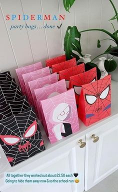 spiderman party bags are lined up on the counter